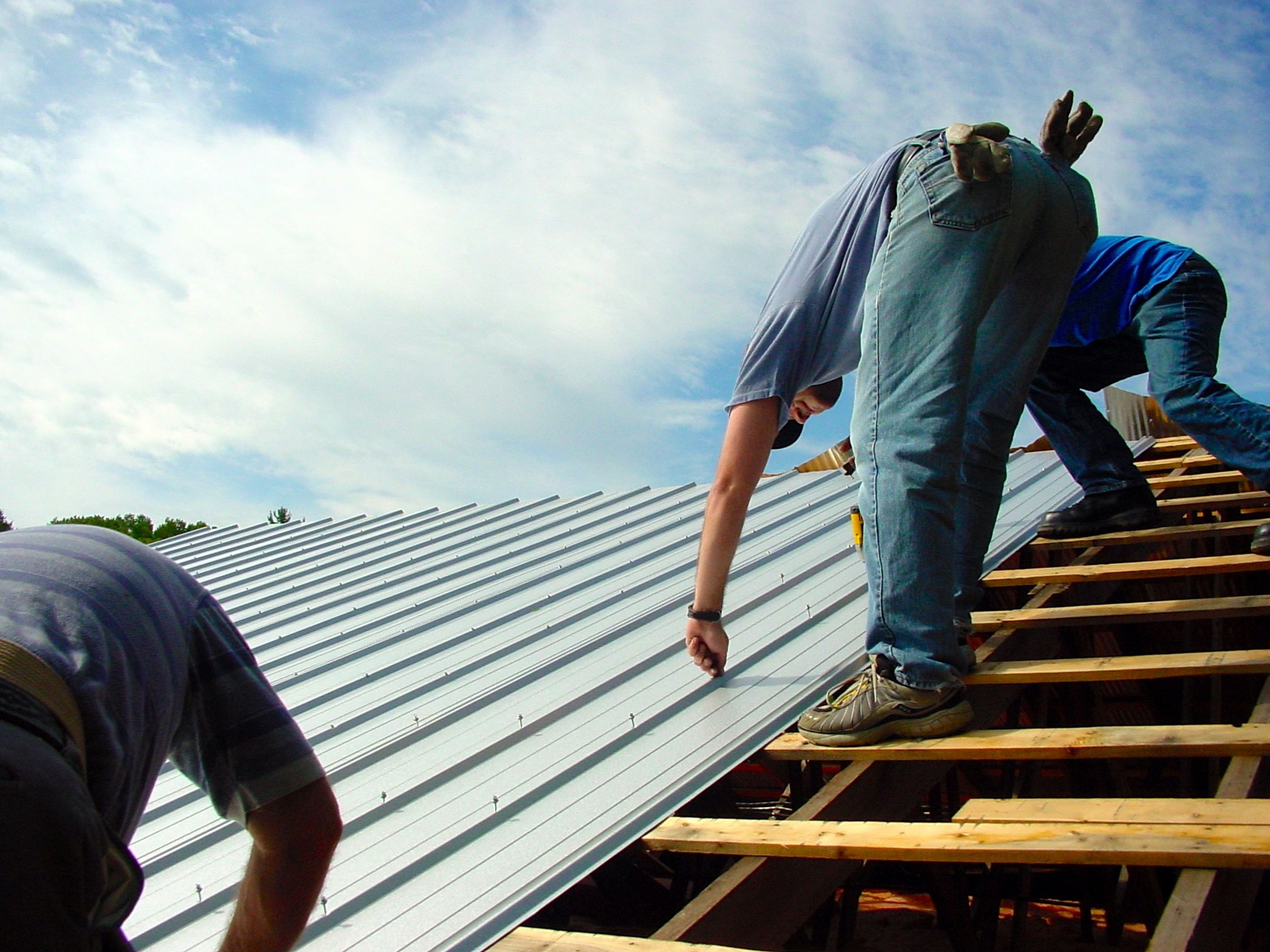 Roofers installing fortified roofing